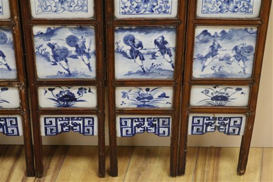 A 19th century Chinese blue and white porcelain panelled screen length 136cm
